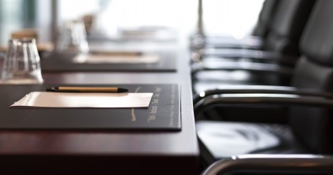 Chairs and a table with pen and paper