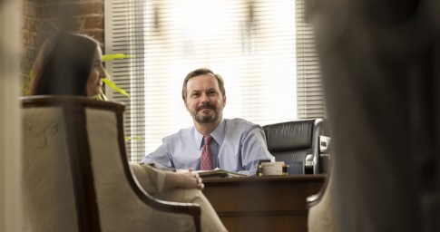 attorney talking at desk