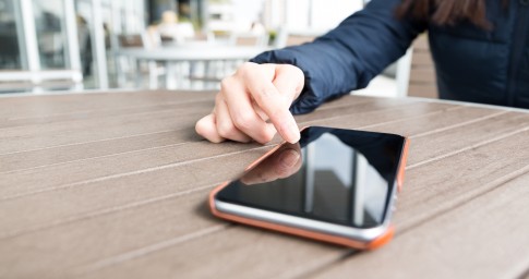 Women touching cell phone